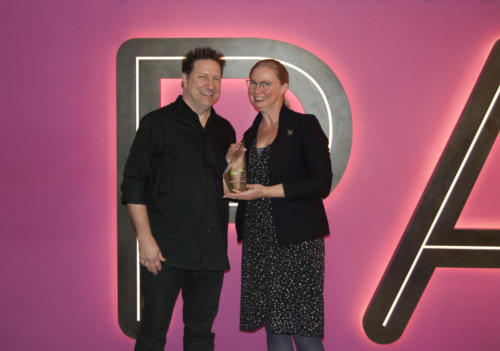 Snowden Becker, recipient of the 2019 William S. O'Farrell Award with presenter Dino Everett. 